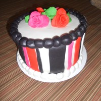 Stripe Birthday This cake did not cooperate with me.It was MM fondant over choc and van cake.