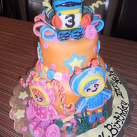 ***umi Zoomi*** This cake was made with Pettinice fondant that was colored using Wilton Color Mist.Figures were modeling choc. covered RKT.I really enjoyed...