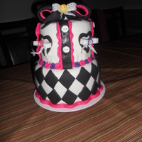 ***alittle Couture*** This is my second attempt at working with fondant.I have definatly corrected the mistakes from my 1st cake.I think this one is an "ode...