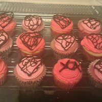 Valentines Day Cupcakes I made these for my Valentine's Day potluck at work. Vanilla Cake with buttercream frosting. I made the decorations on top by piping...