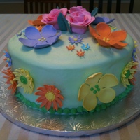 Birthday Cake Yellow cake with fresh strawberry filling and cream cheese frosting and gumpaste flowers