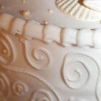 Wedding Cake With Scroll Work White chocolate seashells, butter cream