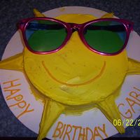 Sunny Sunshine! This was a fun cake to make! Except, i forgot to put foil on my cardboard so the grease from the buttercream wouldn't soak through. Oh...