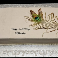 Peacok Feather Birthday Cake This was for a 1st birthday. The theme was peacock feather. The feather is an edible image..