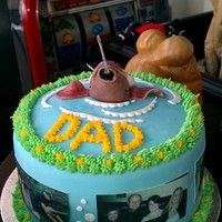Fishing Fathers Day Cake A fish been hooked out of the water, with edible pictures of my dad, my sisters and his grand children for fathers day. cake is carrot cake...