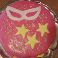 Carnival Cake For School Carnival Strawberry and cherry filled cake in pink fondant with some decoration fitting the carnival theme.