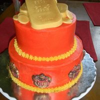 King's Cake Red buttercream cake. Used Chocolate and gold luster dust for the gold bars, made the crowns from chocolate (red and milk chocolate) and...