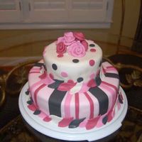 Pink Striped And Polka Dot 2 Layered Cake This is a 6" and 10" layered cake (yellow cake with blackberry filling and vanilla buttercream covered in fondant.
