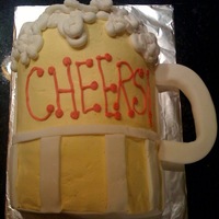 Beer Cake Birthday cake for a beer aficionado. Used two 9" cakes, cut in half and stacked on the cut edge to make the mug.