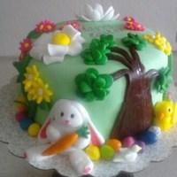 Happy Easter! Torted strawberry and banana layers w/ strawberry cream filling. Covered in fondant w/ fondant decorations.