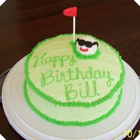 Golf Birthday Chocolate cake with buttercream icing. Golf ball, and flag are made of rolled buttercream. Basic golf birthday cake!