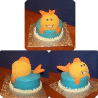 Goldfish Cake Both chocolate and yellow cake. Alternated layers. 2 layers on bottom, and then two small layers make up the fish. All buttercream icing....