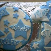 1St Birthday Boy Cake Number 1 was cut out of 9 X13. Iced in buttercream. Stars are mm fondant.Round was Golden cake, 1 was choc. cake (for variety).