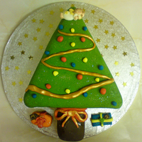 Christmas Tree Cake Christmas cake covered with marzipan and sugarpaste icing.