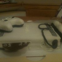 Xbox 360 Controllers are made from rice krispy treats. Game Disc is made from Melted Chocolate. Cake is Chocolate with homemade buttercream icing...