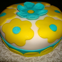 Birthday Cake With White, Yellow, And Teal Fondant I made this with a vanilla cake and strawberry filling. Delicioso!