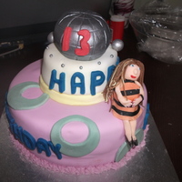 13Th Birthday a two tiered 13th birthday cake with a girl on it altho i do need to practice making people