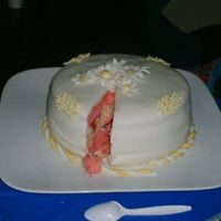 Daisy Fondant Birthday Cake This is my second attempt to making a fondant (marshmallow) cake. The daisies are made out of fondant also. This is a strawberry cake with...