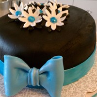 Class 3 - Final Cake First fondant cake - Root beer float cake, vanilla and rootbeer cream filling, vanilla BC under fondant. Fondant bow and flowers