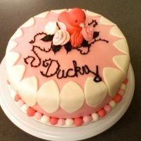 Ducky - Pretty In Pink vanilla and chocolate cake filled with basic butter cream. And decorated with 'Pretty in Pink' colors, along with a Ducky and...