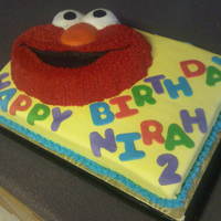 Elmo Cake I made this cake for my granddaughter's 2nd birthday. She loves Elmo. I used a sheet cake for the base and covered it with marshmallow...