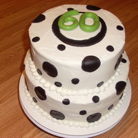 60Th Birthday This is a three layer, basic white cake with BC frosting. Dots and "60" are in fondant to match the invitations to the party.