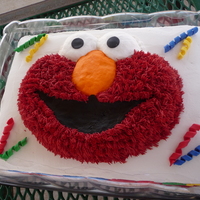 Elmo Cake 1/2 sheet cake with Elmo pan cake on top. Letters and numbers made from fondant