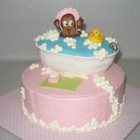 Monkey In A Bubble Bath This was for a friend's baby shower. The bathtub is cake, the monkey is fondant, the ducky is rubber. Strawberry cake with vanilla...