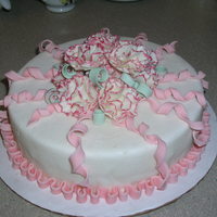 My Class Project For Wilton Gum Paste & Fondant Class I got an A+ for this "cake". Actually a styrofoam form with rolled fondant and gum paste ribbon accents and carnations tipped in...