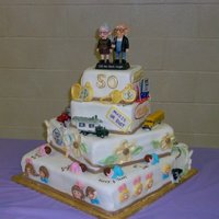 Folk's 50Th For Mom and Dad's 50th. Some of the decorations are plastic, most are fondant. The cake served as kind of a time line of their 50...