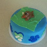 Dog Cake With Paw Prints Fondant cake for the Peace, Love, and Dog Paws benefit in Alabama. Fondant blanket and puppy on top.