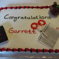 Graduation Cake my inspiration was a cake I saw on CC I have forgotten who it was done by though sorry about that. apple and book RKT covered in fondant.
