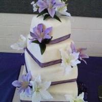4 Tier Wedding Cake fondant, decorated with silk flowers