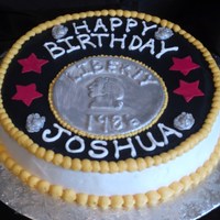 Marine Corp/ Quarter Cake Eagle Globe and Anchors are edible white chocolate made with a mold and covered in silver luster paint.