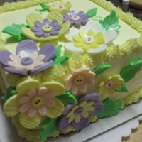 Lemon Buttercream Lemon buttercream icing with button fondant flowers.
