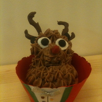 Reindeer Cupcake A cupcake reindeer sitting in a homemade case, covered in chocolate buttercream.