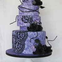 Christian Lacroix Inspired Wedding Cake Fashion designer Christian Lacroix inspired 4 tier couture wedding cake. All hand painted lace, purple sponge technique, and black gum...