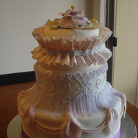 Final Project For Gum Paste And Fondant With Colette Peters Class Three tier fondant covered cake. Cake topper is a gum paste oriental peony flower with ivy leaves. Top tier has a fondant/gum paste mix...