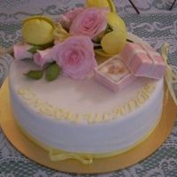 Engagement Cake Modelling paste roses, tulips, ring and box. chocolate cake filled with Nutella and strawberries.