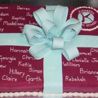 Year Six Graduation Cake This is two layers of chocolate cake filled with chocolate fudge and covered in fondant. The bow is modelling paste and the writing is...