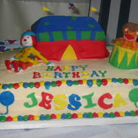 Jojo's Circus Made in 2005 for my daughter's 1st birthday. My first big cake. Icing and leveling could have been better, but I do like the way the...