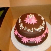 Bridal Shower Cake done with chocolate fondant. The first layer had rasberry filling and the top layer had chocolate filling. This was a hit. Flowers...