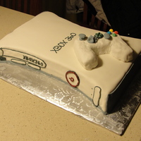 Xbox 360 white cake, strawberry filling, buttercream icing covered in fondant. The controller is rice krispie treats covered in fondant. Thanks for...