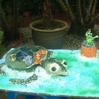 Where's Nemo??crush The Sea Turtle!! Dory and Marlin made from sugarpaste and Crush decorated in fondant.It was my daughter's 2nd bday yesterday. Crush was a 9 inch round...