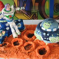 Buzz Lightyear buzz was made from sugarpaste and the rest was chocolate cake. Since buzz was a little 'big', i had to support him with the...