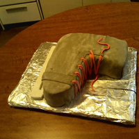 Hockey Skate 2d fondant cake I made for my team.This was before I steamed it to make it shine and the color even