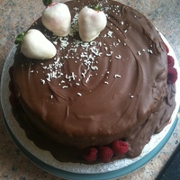 Chocolate Lovers Cake! A very chocolatey cake for a chocolate cover! Chocolate sponge with ganache filling. Cake covered in melted chocolate and strawberries...