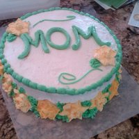 Mother's Day Cake Swiss chocolate layer cake with buttercream frosting and royal icing flowers.