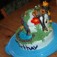 Frog And Toad My first cake here and my first cake using modeling chocolate.Made for my 9 year old sister's birthday part, she is a big fan of the...