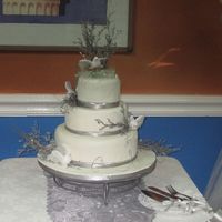 Img_1785.jpg Jamaican Fruit cake covered with fundant. Simply delicious the bride ran up and hugged me and said she loved everything about this cake. I...